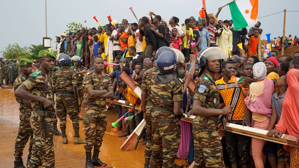 epa10836878 Supporters of the military junta protest against the French military presence at the roundabout leading to the French base in Niamey, Niger, 02 September 2023. Thousands of people gathered outside the base to ask the French troops to leave and accusing Paris of' 'blatant interference' by backing ousted President Bazoum.  EPA/ISSIFOU DJIBO