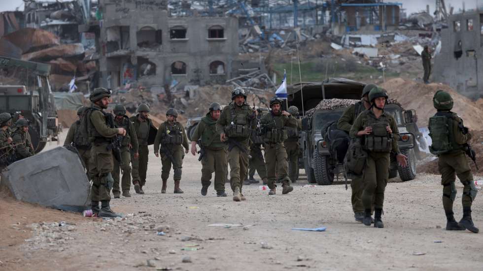 epa11018159 A photo taken while embedded with the Israel Defense Forces (IDF) shows Israeli soldiers taking position in the Palestinian town of Beit Lahia, on the outskirts of the city of Gaza, northern Gaza Strip, 08 December 2023. Israeli forces resumed military strikes on Gaza after a week-long truce expired on 01 December. More than 16,200 Palestinians and at least 1,200 Israelis have been killed, according to the Palestinian Health Ministry and the Israel Defense Forces (IDF), since Hamas militants launched an attack against Israel from the Gaza Strip on 07 October, and the Israeli operations in Gaza and the West Bank which followed it. The Israeli military stated that its forces are involved in 'ground operations' against Hamas in the Gaza Strip, including the south of the enclave.  EPA/ATEF SAFADI