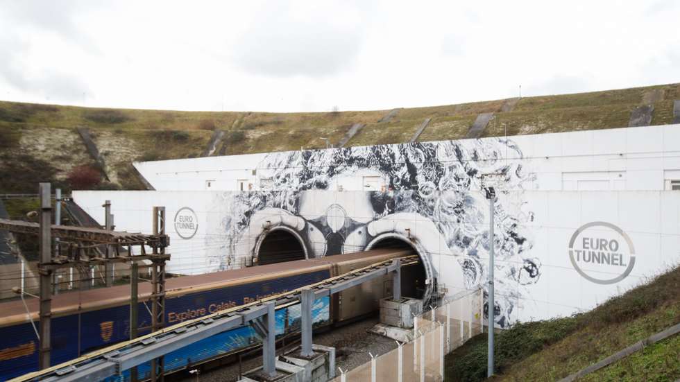 epaselect epa11029681 A freight train leaves the Eurotunnel in Coquelles, northern France, 14 December 2023. For 30 years, the Eurotunnel has been connecting the 50 kilometers that separate the United Kingdom and Europe. 480 million passengers have been transported on Le Shuttle ships or on the Eurostar high-speed train since 1993. The Coquelles terminal in France handles up to 400 trains and ships every day. 25 percent of trade between the United Kingdom and Europe is carried through Eurotunnel, two million passenger cars and 1.4 million trucks were transported through the tunnel in 2022, according to the company.  EPA/TERESA SUAREZ  EPA-EFE/TERESA SUAREZ