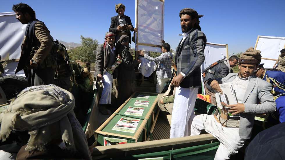 epa11075830 Houthi fighters ride a vehicle carrying the coffin of a slain comrade who was killed in recent US-UK-carried out airstrikes on Houthi sites, during a funeral at the Shaab mosque in Sana'a, Yemen, 14 January 2024. At least six Houthi fighters were killed and five others wounded in airstrikes carried out on 12 January 2024 by the US and Britain against several Houthis-controlled sites in Yemen in response to recent Houthis attacks on shipping lanes in the Red Sea, according to the Houthis military spokesman Yahya Sarea. The US Department of Defense had announced in December 2023 a multinational operation to safeguard trade and to protect ships in the Red Sea amid the recent escalation in Houthi attacks. Houthis vowed to attack Israeli-bound ships and prevent them from navigating in the Red Sea and the Bab al-Mandab Strait in retaliation for Israel's airstrikes on the Gaza Strip, according to Sarea.  EPA/YAHYA ARHAB