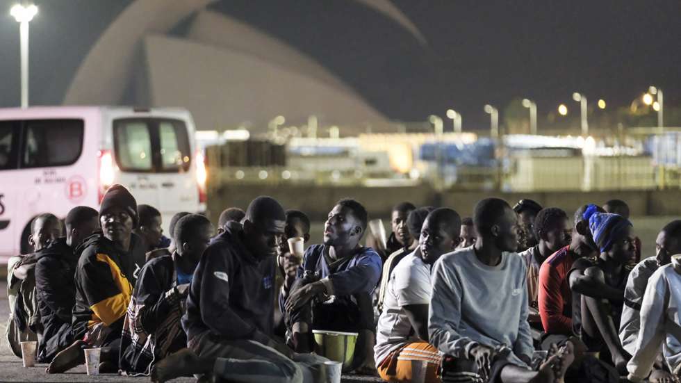 epa11072775 Migrants are assisted by members of the 'Guardamar Urania' vessel after arriving in Santa Cruz de Tenerife, Canary Islands, Spain, 12 January 2024. The 'Guardamar Urania' rescue vessel of Maritime Safety and Rescue Society (Salvamento Marítimo) transferred to Santa Cruz de Tenerife 61 immigrants who were on board a cayuco, located between Tenerife and Gran Canaria. The cruise ship 'Mein Schiff 1' provided the first instance.  EPA/Alberto Valdés