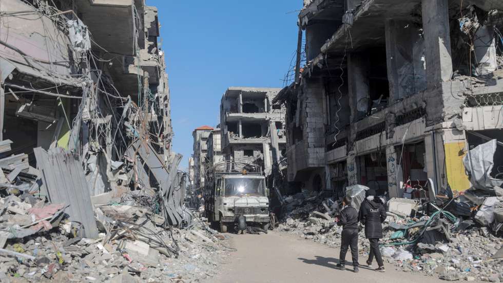 epa11118472 Palestinians walk among destroyed buildings in Al Nuseirat refugee camp, Gaza Strip, 01 February 2024. More than 27,000 Palestinians and over 1,300 Israelis have been killed, according to the Palestinian Health Ministry and the Israel Defense Forces (IDF), since Hamas militants launched an attack against Israel from the Gaza Strip on 07 October 2023, and the Israeli operations in Gaza and the West Bank which followed it. Since 07 October 2023, up to 1.9 million people, or more than 85 percent of the population, have been displaced throughout the Gaza Strip, some more than once, according to the United Nations Relief and Works Agency for Palestine Refugees in the Near East (UNRWA), which added that most civilians in Gaza are in 'desperate need of humanitarian assistance and protection'.  EPA/MOHAMMED SABER