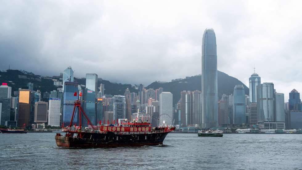 epa10720341 A fishing boat with a celebratory slogan “Unstoppable advantage of patriots administering Hong Kong” sails across Victoria Harbour in Hong Kong, China, 01 July 2023. The city marks the 26th anniversary of the former British colony's return to Chinese rule and the establishment of the Hong Kong Special Administrative Region of the People's Republic of China (Hong Kong SAR or HKSAR) on 1 July 2023.  EPA/Bertha WANG