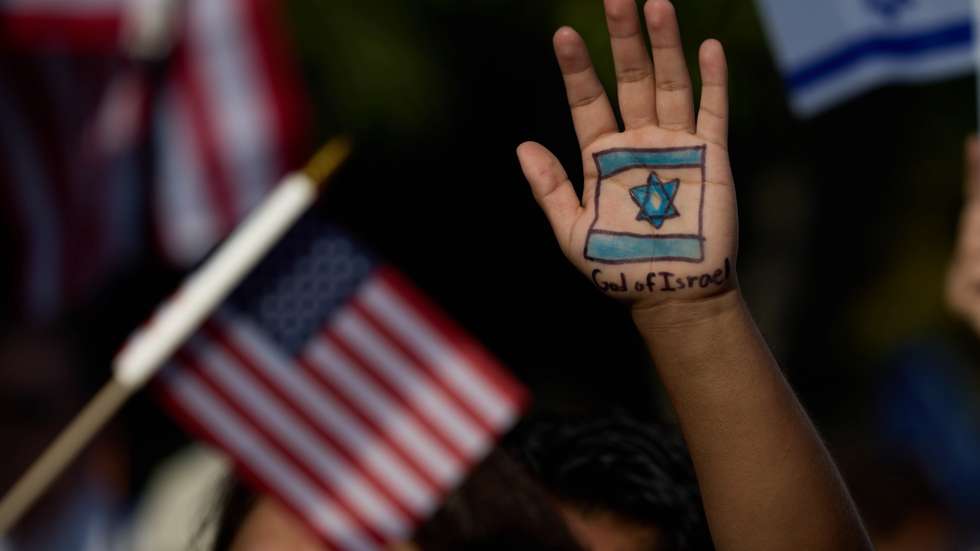 epaselect epa11328273 A hand with the Israeli flag drawn on it is raised at a pro-Israel march outside the University of Southern California (USC) in Los Angeles, California, USA, 08 May 2024. Nationwide protests have sprung up across the country on school campuses, many calling for institutions to divest investments in Israel and in support of a ceasefire in the Gaza conflict.  EPA/ALLISON DINNER