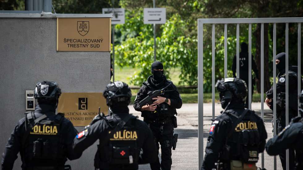 epa11350196 Police officers patrol outside the Special Criminal Court where shooting suspect Juraj C., charged with the attempted murder with premeditation of Slovak Prime Minister Robert Fico, is being interrogated in Pezinok, Slovakia, 18 May 2024. Slovak Prime Minister Robert Fico was shot and injured in Handlova on 15 May and transported to a hospital in a life-threatening condition; the shooting suspect was arrested on spot. The prosecutor requests custodial prosecution of Juraj C.  EPA/JAKUB GAVLAK