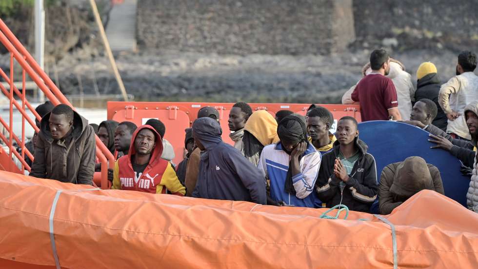 epa11392938 Migrants stand on board a ship of the Spanish Sea Rescue Unit upon its arrival at La Restinga port, El Hierro island, Canary Islands, southwestern Spain, 06 June 2024. Spanish authorities rescued 190 people who were traveling aboard a barge in the Atlantic Ocean, some 112 miles off the coast of La Gomera island.  EPA/GELMERT FINOL