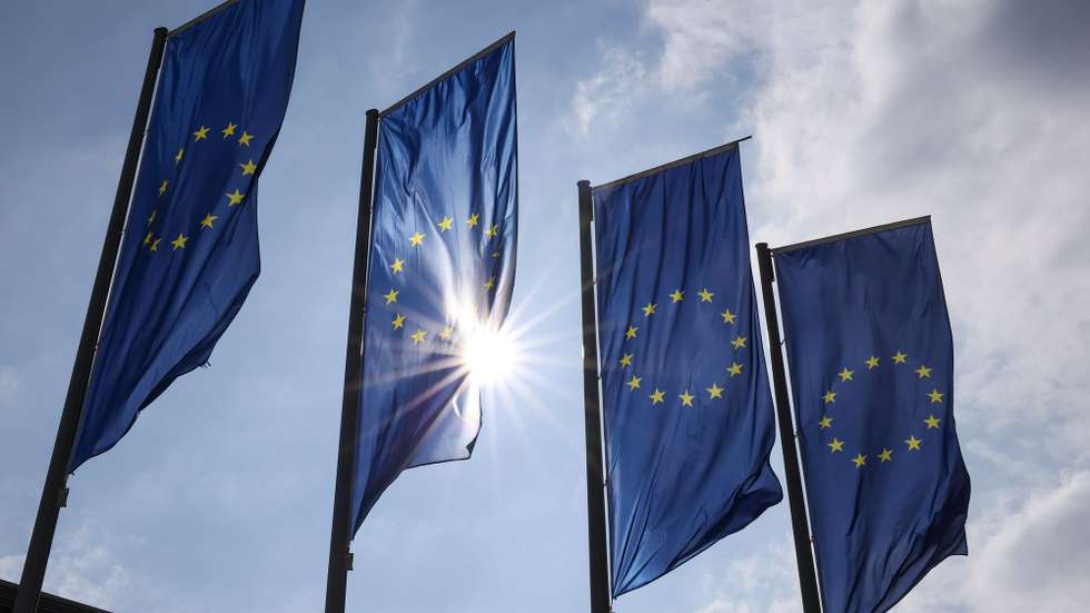 epa11204093 European Union flags are seen outside of the European Central Bank (ECB) building before a press conference following the meeting of the ECB Governing Council in Frankfurt am Mainn, Germany, 07 March 2024.  EPA/CHRISTOPHER NEUNDORF
