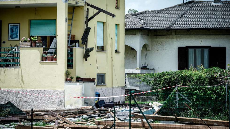 epa11447108 A building with its roof damaged by a whirlwind in Busano Canavese, near Turin, Italy, 30 June 2024. Storms hit the Alpine valleys of Turin, in particular the Orco Valley, on 29 June, causing landslides, floods, and overflowing streams, and leaving people displaced and some localities isolated. Dozens of people had to leave their places of residence late on 29 June due to the severe weather.  EPA/TINO ROMANO