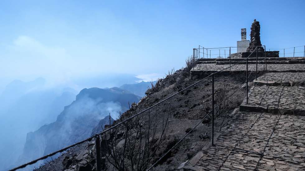 Geodesic landmark on Pico Ruivo, the highest point on Madeira Island, from where you can see the clouds of smoke from the fire that has been raging on Madeira Island, municipality of Santana, 21 August 2024. The rural fire on the island of Madeira broke out a week ago, on 14 August, in the mountains of the municipality of Ribeira Brava, gradually spreading to the municipalities of Câmara de Lobos, Ponta do Sol and, through Pico Ruivo, Santana. HOMEM DE GOUVEIA/LUSA