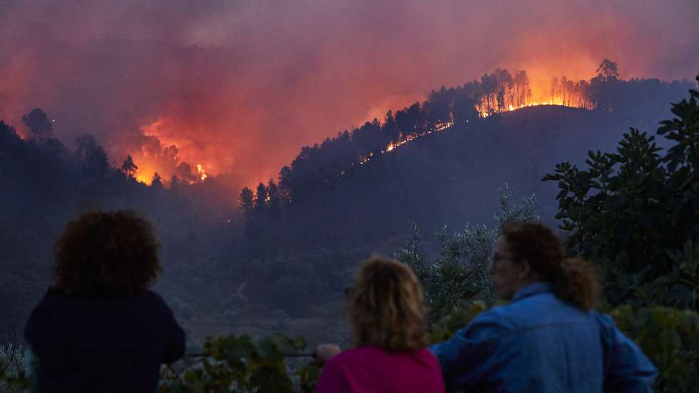 People watch the flames in the forest fire in Silvares, Fundao, Castelo Branco, Portugal, 13 September 2024. MIGUEL PEREIRA DA SILVA/LUSA