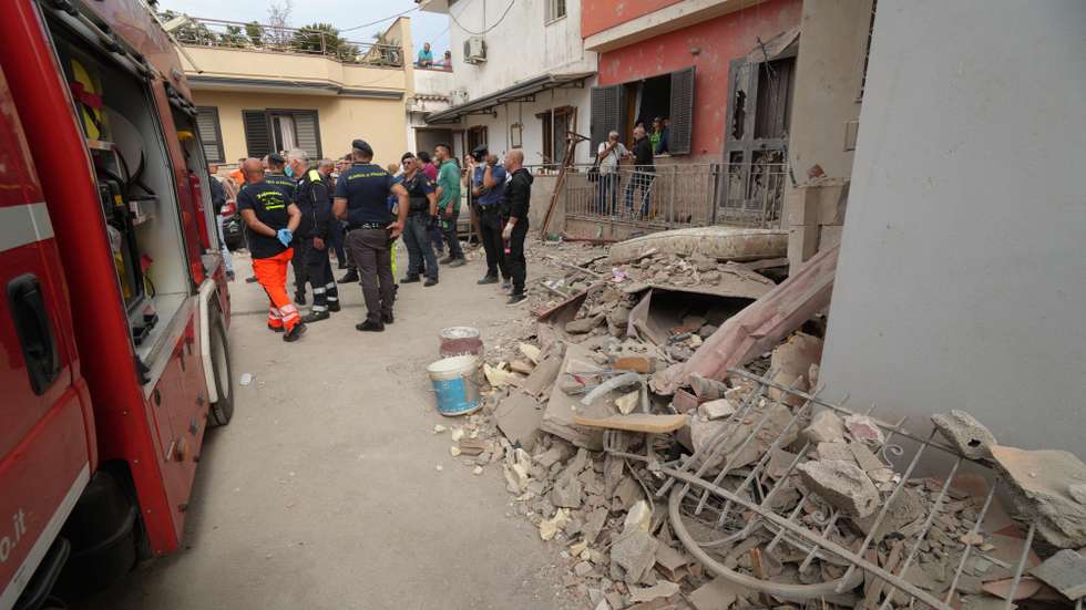 epa11618832 Emergency personnel and law-enforcement work at the site of a collapsed building in Saviano, Naples district, southern Italy, 22 September 2024. Two siblings aged four and six are dead after an apartment building collapsed in the town of Saviano, near Naples, on 22 September. Rescuers are searching in the rubble for the children's mother and an elderly woman, who lived in the same building. The children's father and their two-year-old brother were pulled out of the rubble alive. The father is in a critical condition in hospital while the boy is not in a life-threatening condition, ANSA reported. It is suspected that the explosion of a gas cylinder caused the building to collapse.  EPA/CESARE ABBATE