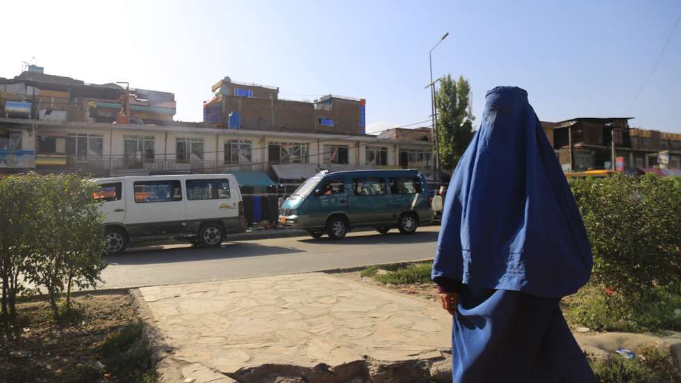 epa11564445 An Afghan woman walks on a road in Kabul, Afghanistan, 25 August 2024. The Taliban in Afghanistan have recently enforced new laws mandating that women must cover their bodies and faces in public, citing these measures as necessary to promote virtue and prevent vice, the Ministry for the Propagation of Virtue and Prevention of Vice said. Approved by their Supreme Leader Hibatullah Akhundzada, the regulations include restrictions on women's voices in public, the prohibition of images of living beings, and bans on music and mixed-gender interactions. The measures have drawn criticism from the United Nations (UN) for fostering fear and intimidation, especially among women and girls, as the Taliban's Ministry for the Propagation of Virtue and Prevention of Vice expands its control over public life.  EPA/SAMIULLAH POPAL