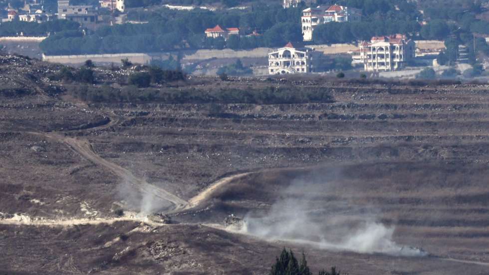 epa11642062 Israeli army corps move in southern Lebanon, as seen from the Upper Galilee, northern Israel, 04 October 2024. The Israeli army reported that multiple projectiles were identified crossing from Lebanon to the Upper Galilee area, with some of the projectiles successfully intercepted while others fell in open areas.  EPA/ATEF SAFADI