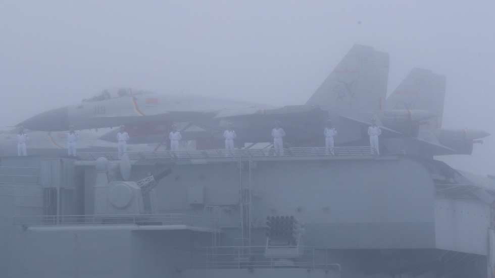 epa07522820 A fighter jet on deck of the Chinese Navy aircraft carrier Liaoning (16) in the fog as it attends a Navy parade to celebrate the 70th anniversary of the Chinese People's Liberation Army (PLA) Navy in Qingdao, China's Shandong province, 23 April 2019.  EPA/WU HONG
