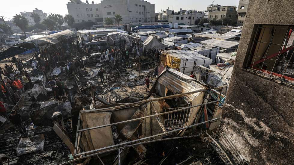epa11657923 Palestinians inspect destroyed makeshift tents at a camp for internally displaced people on the premises of al-Aqsa Hospital, after the area was hit by an Israeli air strike, in Deir al Balah, central Gaza Strip, 14 October 2024. According to the Palestinian Ministry of Health, four people were killed as a result of the strike on al-Asqa hospital, and several dozens were wounded. More than 42,200 Palestinians and over 1,400 Israelis have been killed, according to the Palestinian Health Ministry and the Israel Defense Forces (IDF), since Hamas militants launched an attack against Israel from the Gaza Strip on 07 October 2023, and the Israeli operations in Gaza and the West Bank which followed it.  EPA/MOHAMMED SABER