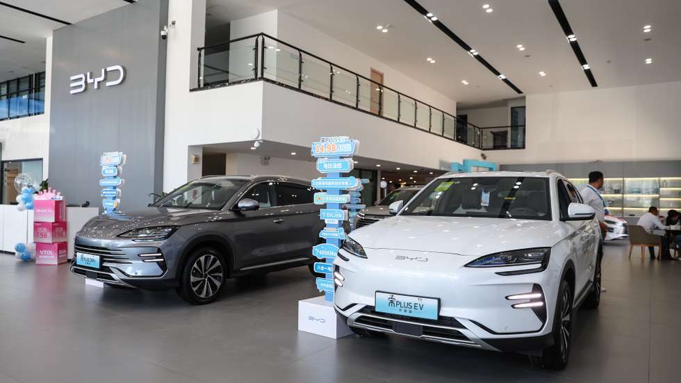 epa11336406 BYD electric cars on display in a BYD showroom in Beijing, China, 13 May 2024. China's vehicle sales grew by 9.3 percent from the prior year to 2.36 million in April 2024, after a 9.9 percent increase in the previous month, the China Association of Automobile Manufacturers said. New energy vehicle sales accounted for 43.5 percent of total car sales in April.  EPA/WU HAO