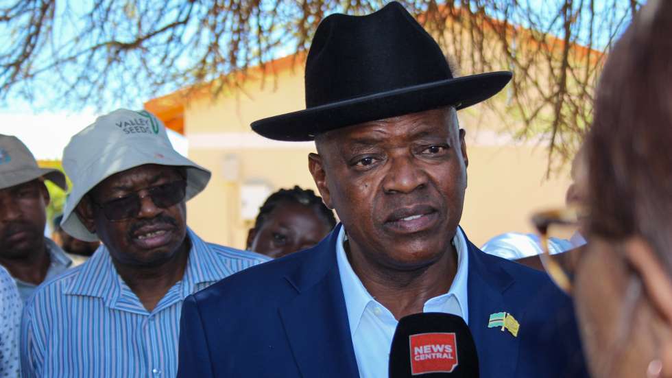 epa11692635 President of Botswana and presidential candidate for Botswana Democratic Party (BDP) Mokgweetsi Masisi (R) talks to media at Mosielele Primary School polling station in Moshupa Village, west of Gaborone, Botswana, 30 October 2024. Masisi is seeking a second and final term to lead the nation of some 2.5 million people.  EPA/JOEL HONORE KOUAM