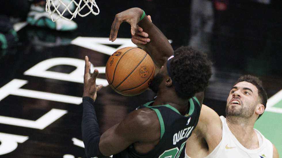 epa11730145 Boston Celtics center Neemias Queta (L) grabs a rebound against Cleveland Cavaliers forward Georges Niang during the first half of an NBA Cup tournament game in Boston, Massachusetts, USA, 19 November 2024.  EPA/CJ GUNTHER SHUTTERSTOCK OUT