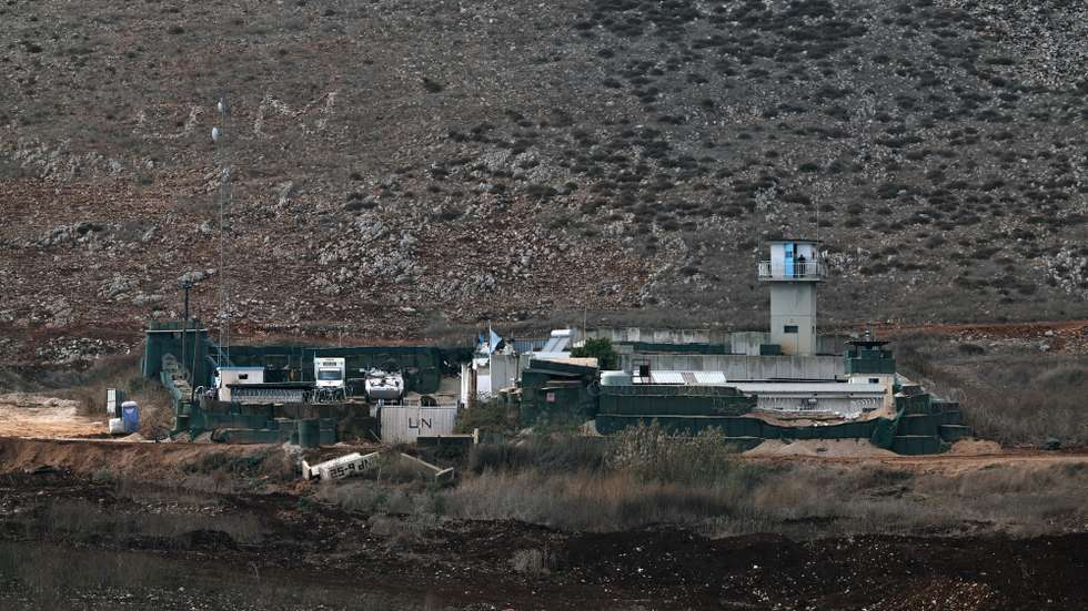 epa11729359 A UNIFIL (United Nations Interim Force in Lebanon) soldier at an obervation tower at the UN base, located  next to the Lebanese village of Maroun Al Ras, as seen from Avivim on the Israeli side of the border on 19 November 2024. The Israeli army reported that the 98th Division has begun conducting targeted raids based on intelligence against Hezbollah in southern Lebanon. According to the Lebanese Ministry of Health, more than 3,500 people have been killed and over 14,900 others have been injured in Lebanon since the escalation in hostilities between Israel and Hezbollah.  EPA/ATEF SAFADI