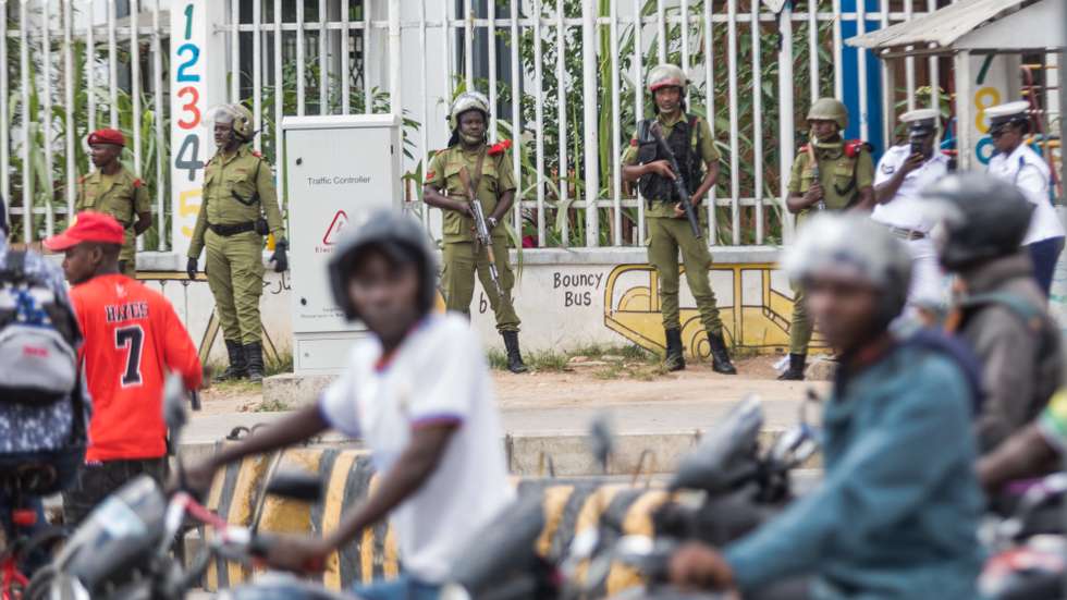 epa11620830 Members of the security forces stand guard after preventing a banned opposition rally from taking place in Dar es Salaam, Tanzania, 23 September 2024. Tanzanian police arrested supporters of the main opposition party Chadema for participating in a banned protest to demand an end to alleged political abductions and killings. According to police, 14 people were arrested, including Chadema party chairman Freeman Mbowe and vice-chairman Tundu Lissu, for defying a prohibition on the protests. Leaders of the opposition have accused Tanzanian President Samia Suluhu Hassan of cracking down on democracy ahead of elections in November 2024 and in 2025.  EPA/ANTHONY SIAME