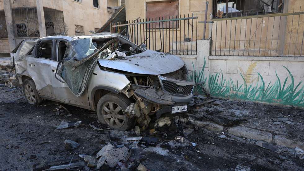 epa11751373 A damaged car after an airstrike in Idlib, northern Syria, 01 December 2024. According to the White Helmets, the Syrian civil group in northwestern Syria, at least eight people, including two children, were killed and 63 others injured in airstrikes carried out on residential neighborhoods in Idlib city. Syrian opposition forces led by the Islamist militant group Hayat Tahrir al-Sham (HTS) launched a large offensive on 27 November, taking large parts of Aleppo, the country's second-biggest city, triggering counterattacks by Syrian regime forces on opposition-controlled areas as well as Russian and Syrian airstrikes.  EPA/MOHAMMED AL-RIFAI