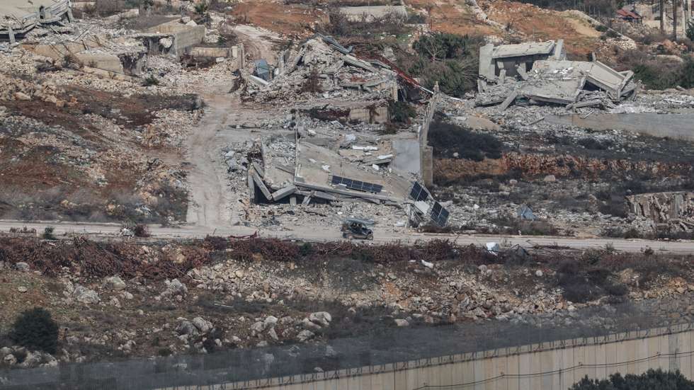 epa11756642 Israeli troops move between destroyed houses, in the south Lebanon village of Odessa, as seen from the Israeli side of the border, 04 December 2024. A 60-day ceasefire agreement between Israel and Hezbollah came into force on 27 November.  EPA/ATEF SAFADI