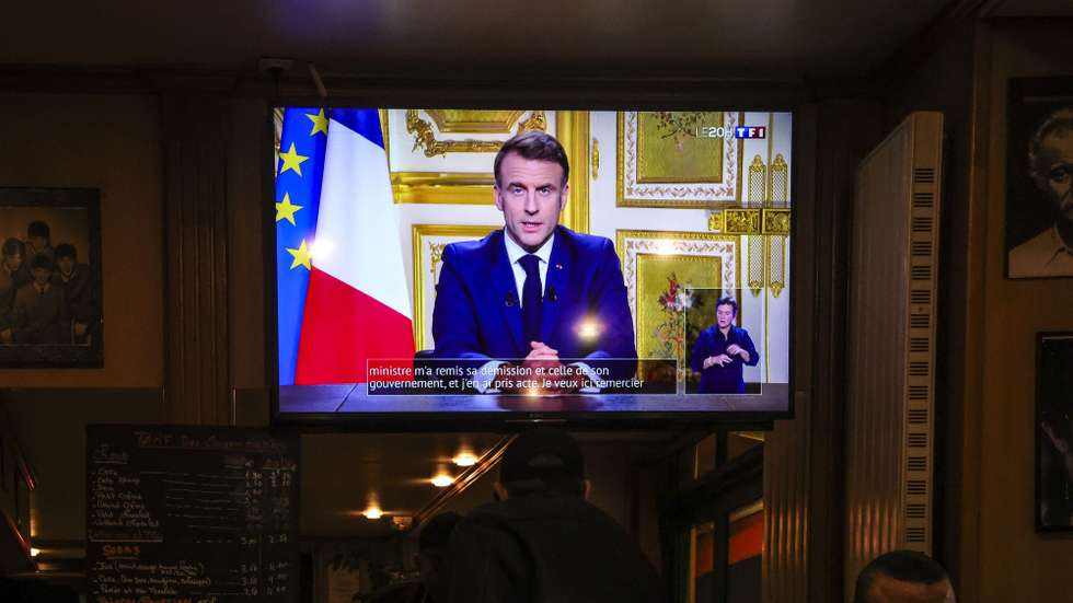 epa11759130 A screen shows the French President Emmanuel Macron delivering a televised speech to the French nation, in Paris, France, 05 December 2024. French President Emmanuel Macron addressed the nation a day after the government of the French Prime Minister Michel Barnier lost a no-confidence vote at the National Assembly.  EPA/TERESA SUAREZ