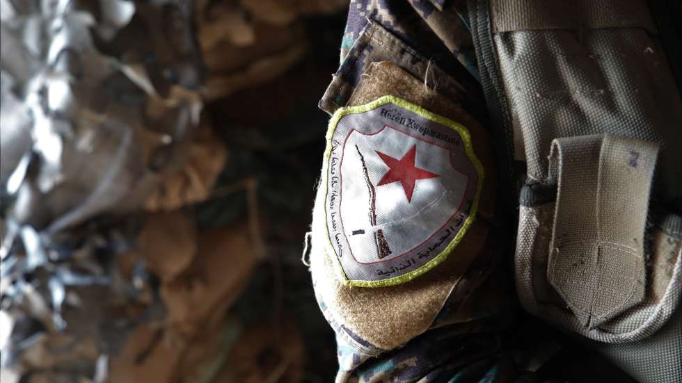 epa07471067 Ocalan Baker, a member of US-backed Kurdish-Arab 'Syria democratic forces' (SDF) during an interview at a military base in northern Syria, 29 March 2019. Baker is one of the thousands of Kurdish fighters, who was lived in Qamishli and worked as a farmer, but he was forced to leave his farm and volunteered in the US-backed Kurdish-Arab 'Syria democratic forces' (SDF) to fight against the Islamic state (IS) group in northern and eastern Syria.  EPA/AHMED MARDNLI