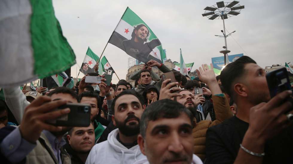 epa11788811 People participate in the 'Liberation Festival', which celebrates the ouster of Syrian President Bashar Al-Assad, at Saadallah al-Jabiri Square in Aleppo, Syria, 21 December 2024.  EPA/BILAL AL HAMMOUD