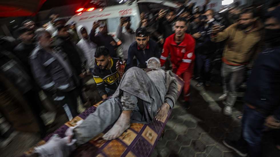 epa11813686 A wounded Palestinian elderly man is taken to Al Aqsa Martyrs Hospital in Deir Al Balah, central Gaza Strip, 08 January 2025. According to the Palestinian Ministry of Health in Gaza, at least five Palestinians were killed and more than 12 others injured after an Israeli airstrike hit Deir Al Balah refugee camp in central Gaza. More than 45,800 Palestinians and over 1,400 Israelis have been killed, according to the Palestinian Health Ministry and the Israeli Army, since Hamas militants launched an attack against Israel from the Gaza Strip on 07 October 2023, and the Israeli operations in Gaza and the West Bank which followed it.  EPA/MOHAMMED SABER