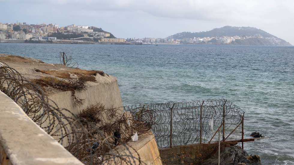 epa11634172 The border fence between Fnideq and the enclave of Ceuta in the northern Moroccan city of Fnideq, 30 September 2024. Moroccan authorities are bracing for another mass migration attempt on 30 September after calls circulated on social media. Hundreds of migrants on 15 September stormed a barbed wire fence to cross the land border from Fnideq to Ceuta, following a similar call on social media, which the Spanish police said all were prevented from entering following a large deployment of security forces on both sides of the border.  EPA/JALAL MORCHIDI
