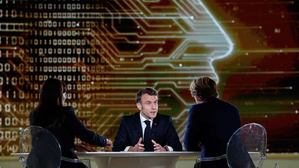 epa11885001 French President Emmanuel Macron (C) attends an interview for national television with French journalist Laurent Delahousse (R) and Indian journalist Palki Sharma Upadhyay (L), ahead of the Artificial Intelligence (AI) Action Summit. The summit takes place from 10 to 11 February.  EPA/GONZALO FUENTES / POOL