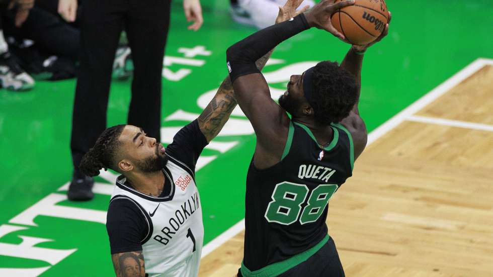 epa11972957 Brooklyn Nets guard D'Angelo Russell (L) can not block the shot of Boston Celtics center Neemias Queta (R) during the first half of the NBA game between the Boston Celtics and the Brooklyn Nets in Boston, Massachusetts, USA, 18 March 2025.  EPA/CJ GUNTHER SHUTTERSTOCK OUT