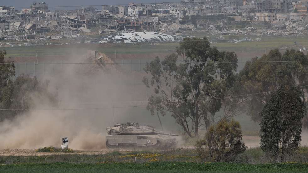 epa11971169 An Israeli tank patrols along the border with the Gaza Strip, as seen from an undisclosed location in Israel, 18 March 2025. The Israeli forces on 18 March confirmed they were carrying out 'extensive strikes' on targets in the Gaza Strip, following an Israeli prime minister's statement which ended the ceasefire in place since 19 January. According to provisional figures released by the Palestinian Health Minister, more than 400 people were killed in a series of overnight strikes in the Gaza Strip.  EPA/ATEF SAFADI