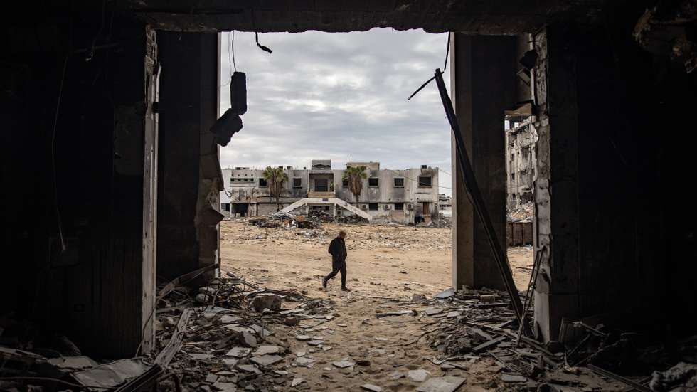 epa11876285 A person walks through the rubble of the Al-Shifa hospital, amid a ceasefire between Israel and Hamas, in Gaza City, Gaza Strip, 05 February 2025. Israel and Hamas implemented the first phase of a hostage release and ceasefire deal on 19 January 2025. More than 46,000 Palestinians have been killed in the Gaza Strip, according to the Palestinian Ministry of Health, since Israel launched a military campaign in the strip in response to a cross-border attack led by the Palestinian militant group Hamas on 07 October 2023, in which about 1,200 Israelis were killed and more than 250 taken hostage.  EPA/HAITHAM IMAD