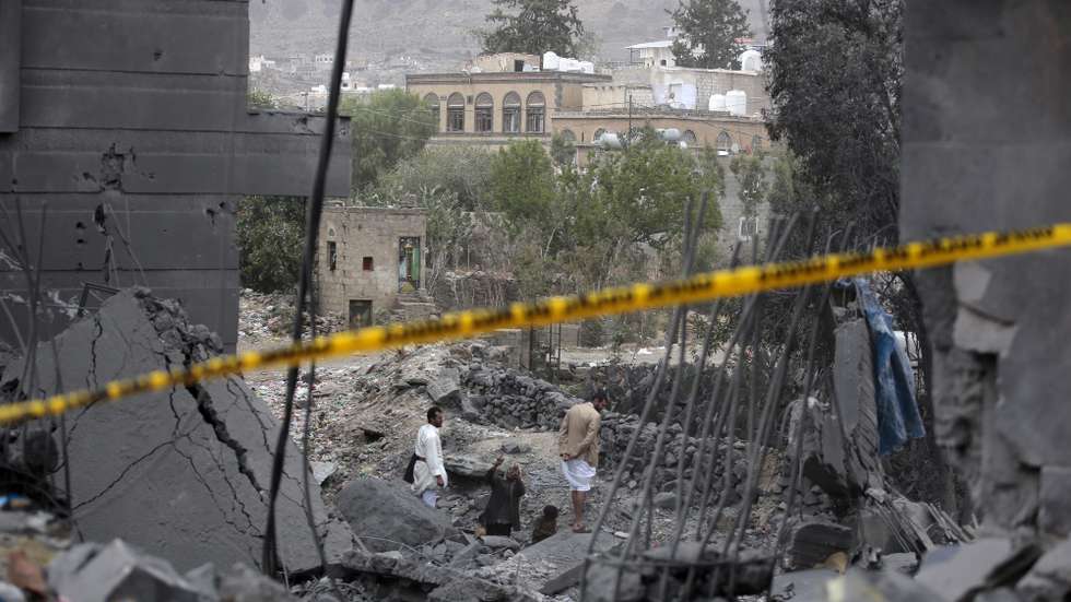 epa11985320 People inspect the damage around a building after US airstrikes in Sana'a, Yemen, 24 March 2025. The Ministry of Health, controlled by the Houthi administration in Sana'a, reported that at least one person was killed and some 15 others were injured in a US airstrike on a residential building in the Ma'in district.  EPA/OSAMAH YAHYA