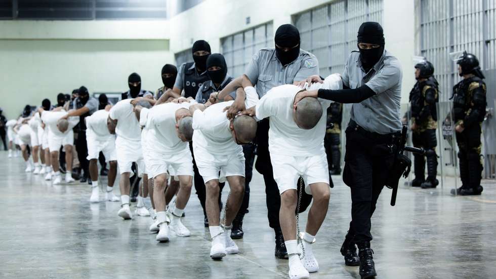 epaselect epa11969342 A handout photo made available by the Presidency of El Salvador shows guards at the Terrorism Confinement Center (Cecot) transferring alleged members of the criminal gang known as Tren de Aragua, in San Luis Talpa, El Salvador, 16 March 2025. The President of El Salvador Nayib Bukele, announced through his X account that the country received 238 members of the Tren de Aragua gang and that they will be held for a year at Cecot.  EPA/Presidency of El Salvador / HANDOUT /EDITORIAL USE ONLY/ ONLY AVAILABLE TO ILLUSTRATE THE ACCOMPANYING NEWS (CREDIT MANDATORY)HANDOUT EDITORIAL USE ONLY/NO SALES