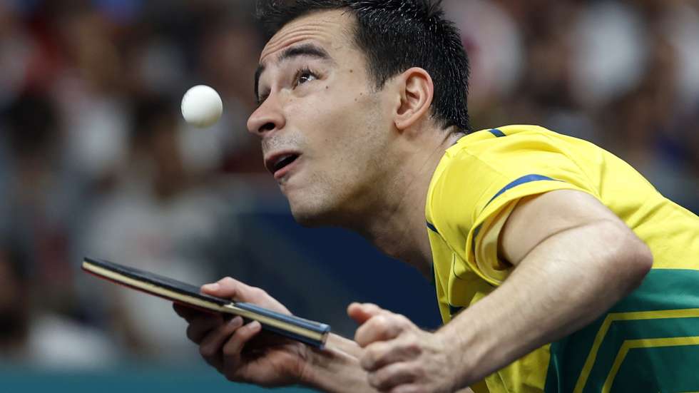 epa11533572 Hugo Calderano of Brazil in action against Felix Lebrun of France during the Men's Team Quarterfinal Game between Brazil and France at the Table Tennis competitions in the Paris 2024 Olympic Games, at The South Paris Arena in Paris, France, 07 August 2024.  EPA/MAST IRHAM