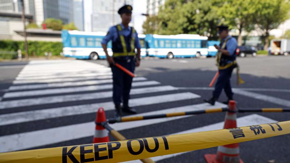epa11667961 Police officers block access to the scene where a vehicle crashed into a fence in front of the prime minister's office in Tokyo, Japan, 19 October 2024. In the early morning hours, a man threw Molotov cocktails toward the Liberal Democratic Party (LDP) headquarters and crashed his car into a fence at the Prime Minister's Office. According to the Metropolitan Police Department, the man was arrested on the spot, and no one was injured.  EPA/FRANCK ROBICHON