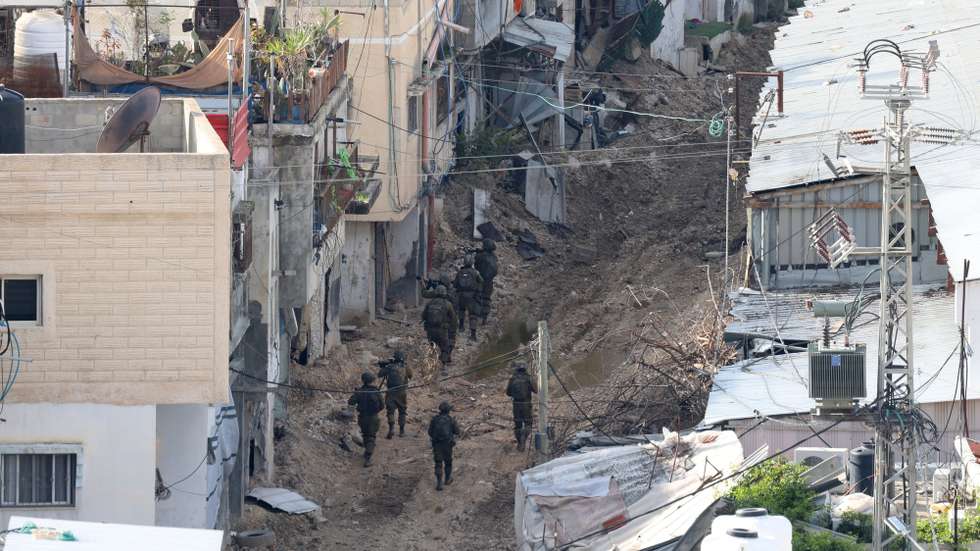 epa11905533 Armed Israeli soldiers patrol in Tulkarem refugee camp, in the West Bank city of Tulkarem, 18 February 2025. According to the Palestinian news agency Wafa, Israeli forces began a 'large-scale demolition of homes' in Tulkarm camp on 18 February, marking the 23rd consecutive day of Israel's military operation in the city and its camp. Dozens of homes have been destroyed in Tulkarm camp since the start of the ongoing Israeli operation, according to Palestinian authorities.  EPA/ALAA BADARNEH