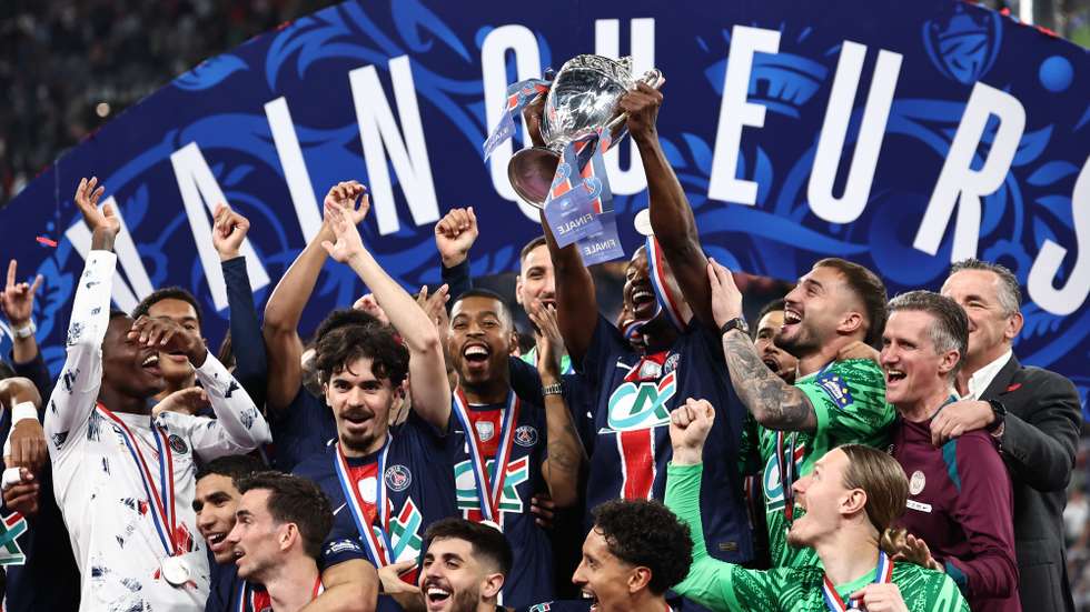 epa12132875 Nuno Mendes of Paris Saint Germain (C) lifts the trophy after the victory in the Coupe de France final soccer match between Paris Saint Germain (PSG) and Reims in Saint-Denis, near Paris, France, 24 May 2025.  EPA/CHRISTOPHE PETIT TESSON