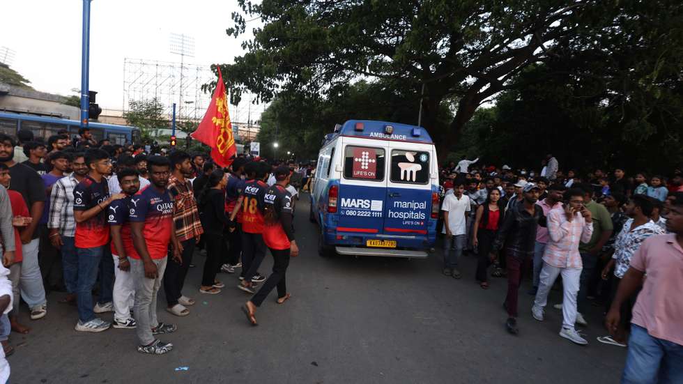 epa12155118 An ambulance transports stampede victims near Chinnaswamy Stadium in Bangalore, India, 04 June 2025. According to the police, at least 8 people died and dozens were injured after a stampede incident occurred when Royal Challengers Bengaluru fans broke through gates and barricades during a felicitation event following RCB's Indian Premier League victory.  EPA/JAGADEESH NV