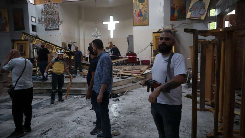 epa12191564 Emergency services and officers work at the scene of a suicide bombing at Mar Elias Church on the outskirts of Damascus, Syria, 22 June 2025. Syrian authorities reported at least nine killed and 13 others injured in the attack, adding the suicide bomber was affiliated with the so-called Islamic State (IS or ISIS) terrorist organization.  EPA/MOHAMMED AL RIFAI