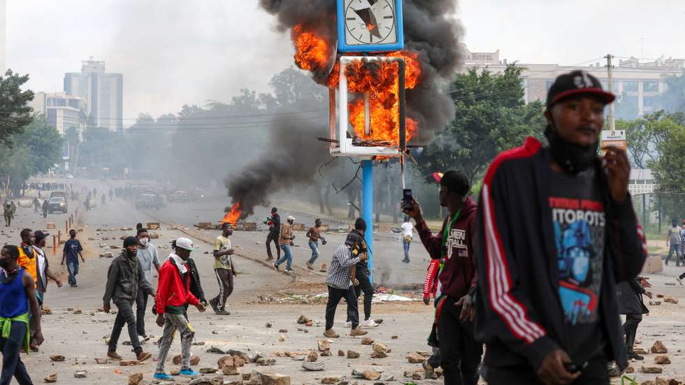 epaselect epa12197029 A city clock post set alight by demonstrators burns during a protest in the central business district of Nairobi, Kenya, 25 June 2025. The protest marks the first anniversary of the Gen Z protests, which culminated with the storming of the national parliament.  EPA/STRINGER