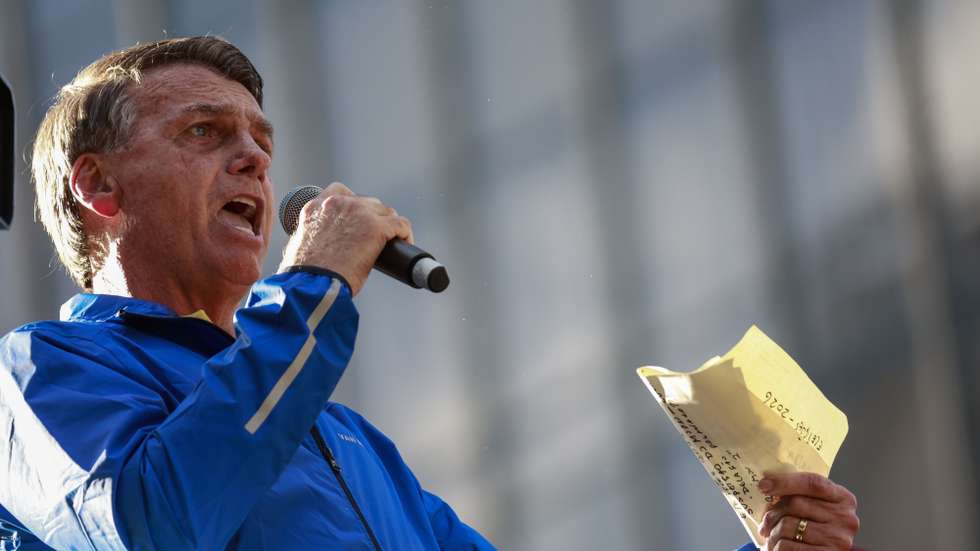 epa12205248 Former Brazilian president Jair Bolsonaro speaks to his supporters at a rally in Sao Paulo, Brazil, 29 June 2025. Brazilians were demonstrating in support of former President Jair Bolsonaro.  EPA/Sebastiao Moreira
