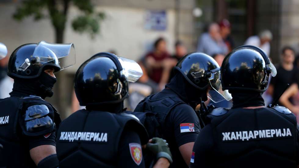 epa12209182 Riot police officers stand guard after removing a road blockade organized by students and anti-government demonstrators in Belgrade, Serbia, 01 July 2025. University students and anti-government protestors are demanding snap elections and release of detained protesters.  EPA/ANDREJ CUKIC