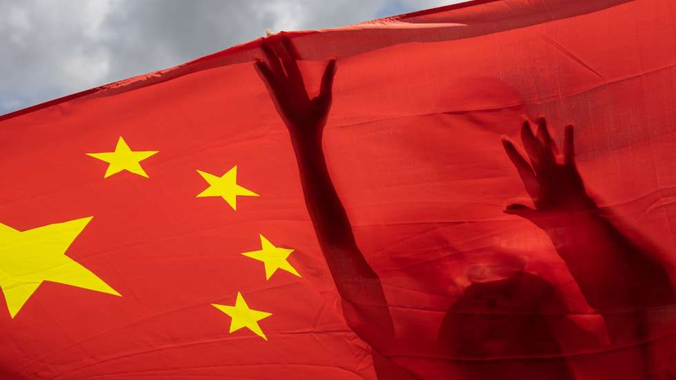 epaselect epa12205628 (FILE) - Pro-China supporters carry a Chinese national flag during a rally celebrating the passage of the national security law for Hong Kong, in Hong Kong, China, 30 June 2020  (reissued 30 June 2025). The fifth anniversary of Hong Kong's National Security Law is marked on 30 June 2025.  EPA/JEROME FAVRE *** Local Caption *** 56184614