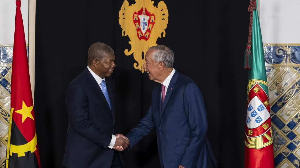 Portugal's President Marcelo Rebelo de Sousa (R) greets Angola's President Joao Lourenco (L) during the welcome ceremony at the Belem Palace in Lisbon, Portugal, 25 July 2025. JOSE SENA GOULAO/LUSA