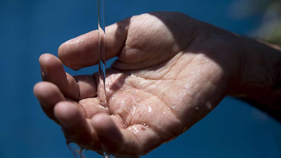 epa06820857 A worker of Hadera seawater desalination plant checks the desalinated sea water in Hadera, Israel, 19 June 2018. After five years of drought and insufficient water flowing from the Jordan River into the freshwater lake Sea of Galilee, the Israeli government approved a project plan to pump 100 million cubic metres of desalinated seawater annually by 2022 into the Sea of Galilee. Desalinated water already makes 70 percent of Israel's tap water. Christians believe Jesus walked on water over Sea of Galilee inland lake.  EPA/ABIR SULTAN