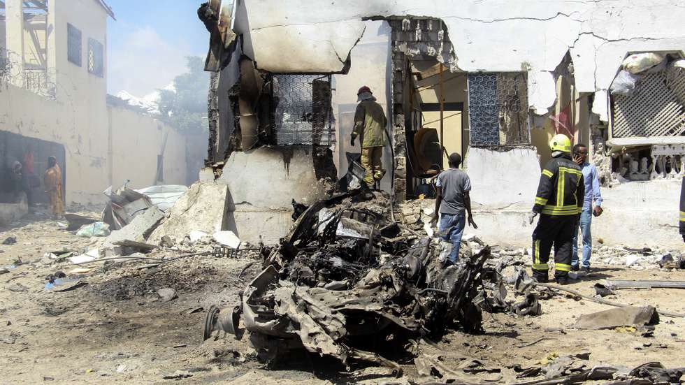 epa09680196 General view of the aftermath of an explosion which took place in Waberi District near the Magadishu airport perimeter, Mogadishu, Somalia, 12 January 2022. According to local reports at least five people were killed and several injured in what appears to be a suicide car bomb attack.  EPA/SAID YUSUF WARSAME